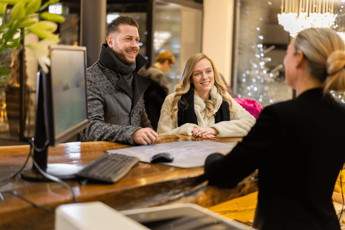 Receptionist talking to guests